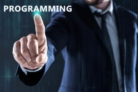 Businessman pointing at word PROGRAMMING on virtual screen, closeup 스톡 사진