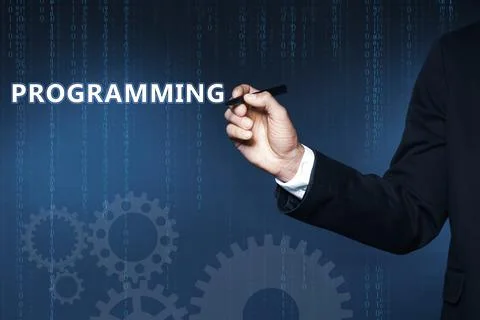 Businessman pointing at word PROGRAMMING on virtual screen, closeup Stock Photos