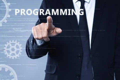 Businessman pointing at word PROGRAMMING on virtual screen, closeup Foto stock