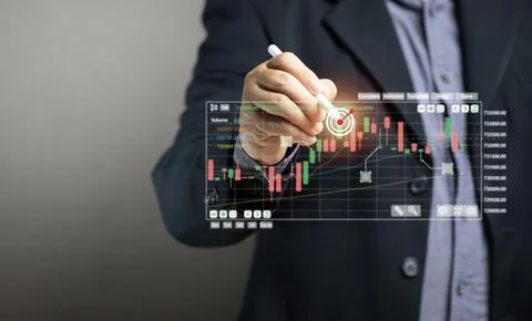Businessman points target at graph on virtual screen, business growth, maxi.. Foto stock