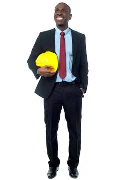 Businessman posing with construction helmet Stock Photos