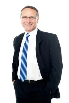 Businessman posing with hands in pockets Stock Photos