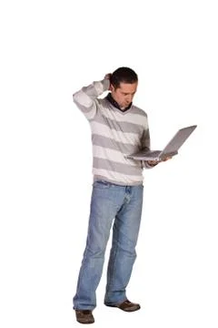 Businessman posing with his laptop Stock Photos