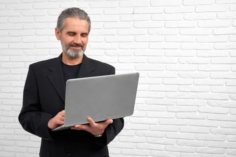 Businessman posing with notebook in studio. Stock Photos