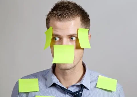 Businessman with post in notes Stock Photos