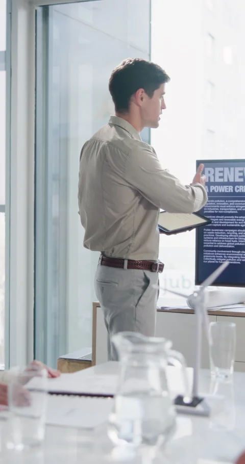 Businessman, presentation and screen in office with windmill, renewable energy Stock Footage 337225838