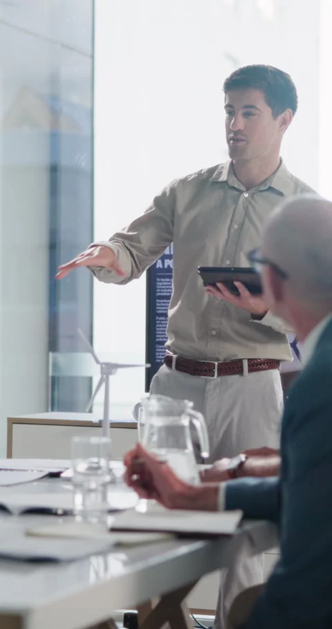 Businessman, presentation and tablet in office with windmill, renewable energy Stock Footage 337222163