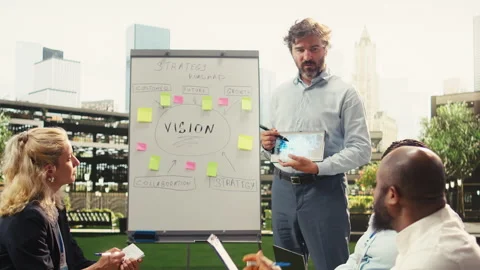 Businessman presenter showing tablet with artificial intelligence system Stock Footage 338385442