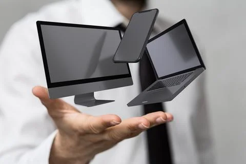 Businessman presenting a 3D render of a computer, laptop and a smartphone Stock Illustration