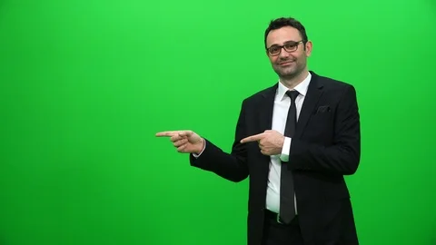 Businessman Presenting in Front of a Green Screen Stock Footage 88651571