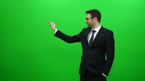 Businessman Presenting in Front of a Green Screen. Right Side. Stock Footage 88651770