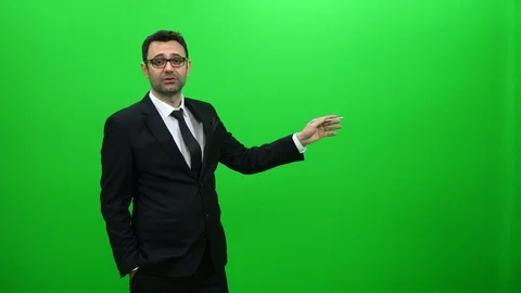 Businessman Presenting in Front of a Green Screen. Left Side. Stock Footage 88651780