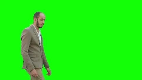 Businessman presenting project looking at camera on a Green Screen, Chroma Key Stock Footage 71203607