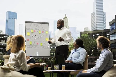 Businessman presenting strategy roadmap at whiteboard during presentation Stock Photos