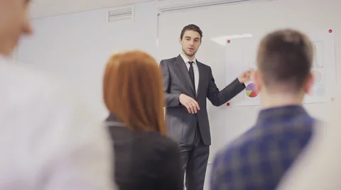 Businessman presenting to the team taking notes in the boardroom. Static shot Stock Footage 66356231