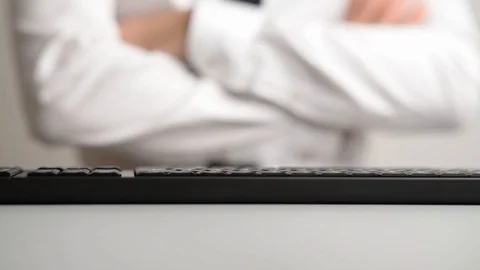Businessman pressing a button on computer keyboard Stock Footage 106919625