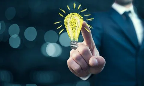 Businessman pressing button with idea on virtual screens Stock Photos