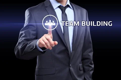Businessman pressing button on touch screen interface and select Team building Stock Photos