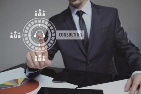 Businessman pressing button on touch screen interface and select Consulting Stock Photos