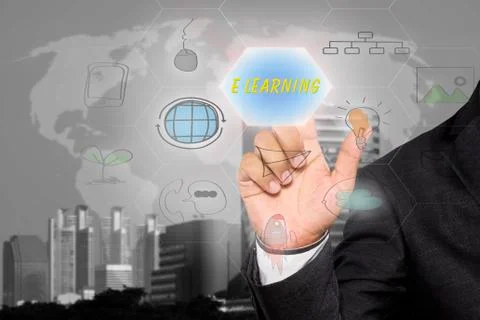 Businessman pressing button touch screen interface and select E LEARNING. Stock Photos