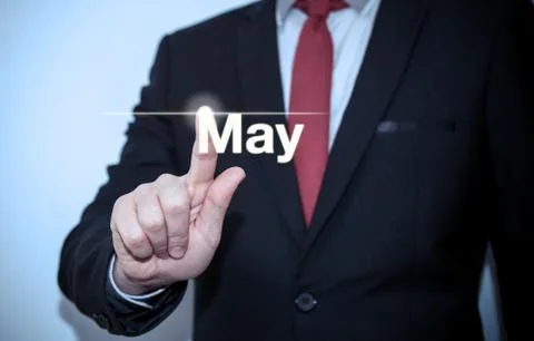 Businessman pressing button on virtual screen May button - concept Stock Photos