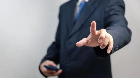 Businessman pressing button on virtual screen.copy Space for text. Stock Photos