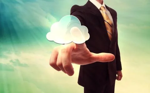 Businessman pressing a cloud computing icon Foto stock