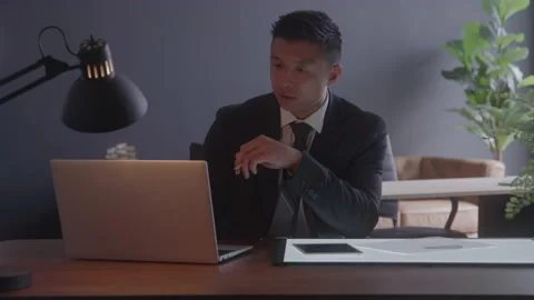 Businessman Problem Solving at His Desk Stock Footage 208804374