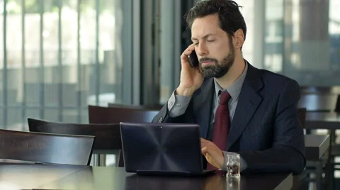 Businessman with problems at work refuse a phone call and drink alcohol Stock Footage 48750674