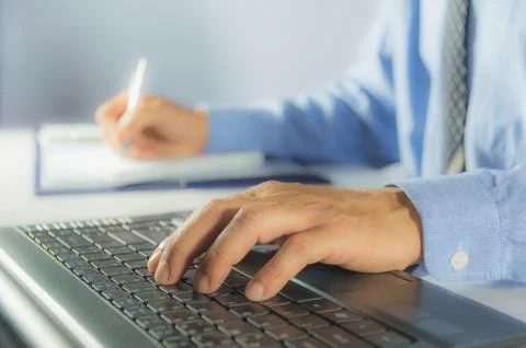 Businessman process with writing and using laptop. Businessman working the pr Stock Photos