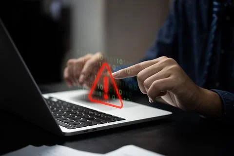 Businessman programmer, developer using laptop computer with triangle cauti.. 스톡 사진