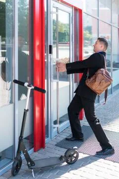 Businessman is pulling the door Stock Photos