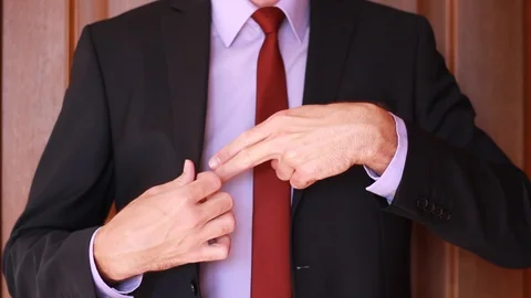 Businessman pulling out his hand as a gun 스톡 동영상 95771744