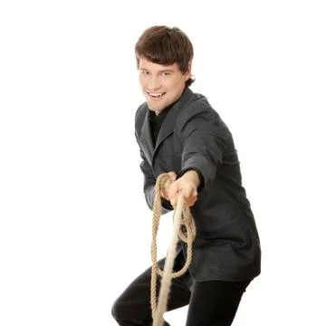 Businessman pulling on a rope Stock Photos