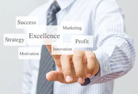 Businessman push excellence button Stock Photos