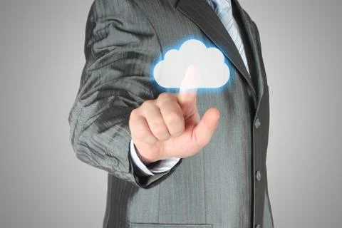 Businessman pushes virtual cloud button. Foto stock