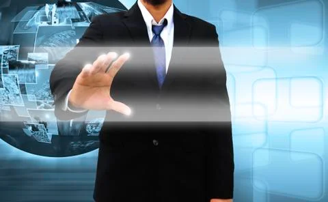Businessman pushing a touch screen interface Foto stock