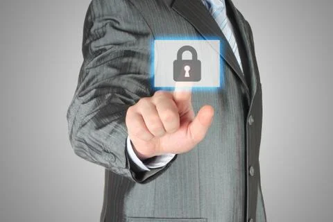 Businessman pushing virtual security button. Stock Photos