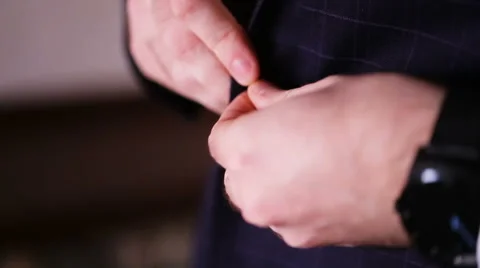 Businessman puts on a jacket Stock Footage 68627362