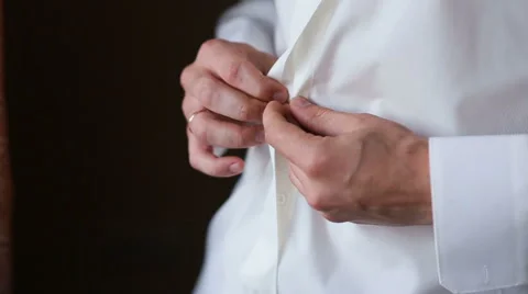 Businessman puts on a jacket Stock Footage 68627843