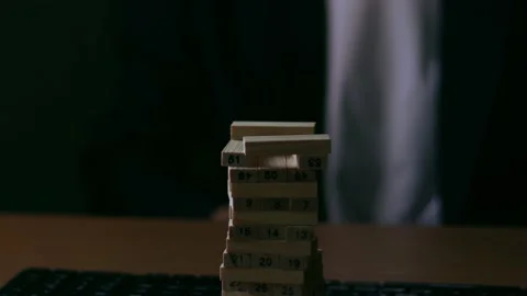 A businessman puts a light on a building block.Idea concept. Stock Footage 166983971