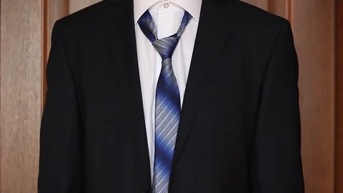 Businessman putting on a tie Stock Footage 70943294