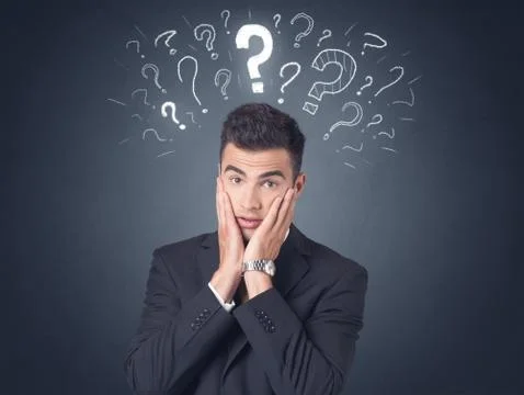 Businessman with question marks Stock Photos