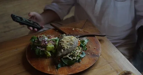 Businessman quickly eats lunch, checking the time after taking a bite. Stock Footage 282962805