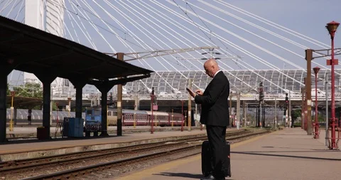 Businessman in Railway Station Text Using Electronic Tablet Waiting Train Stock-Footage 109097282