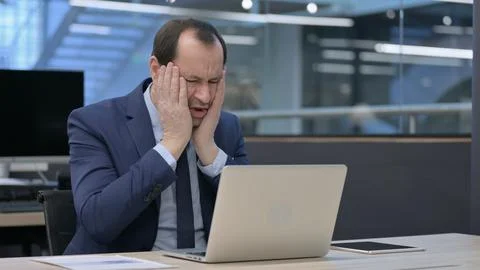 Businessman Reacting to Loss While using Laptop Stock Photos