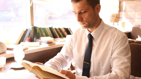 Businessman reading a book Stock Footage 58341048