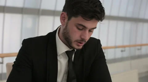 Businessman is reading information on a tablet Stock Footage 41919964