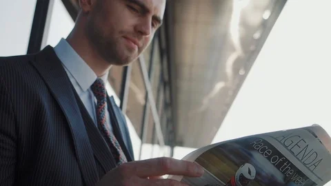 The businessman reading the newspaper Stock Footage 121479932