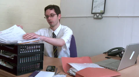 Businessman reading paperwork Stock Footage 30398658